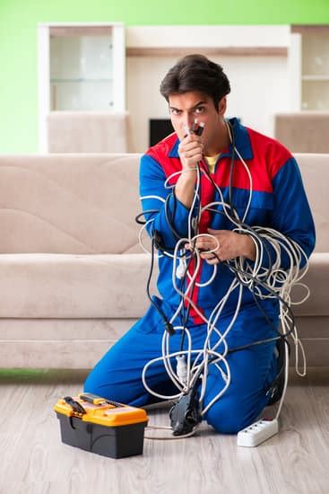 Electrician Contractor With Tangled Cables Photos By Canva