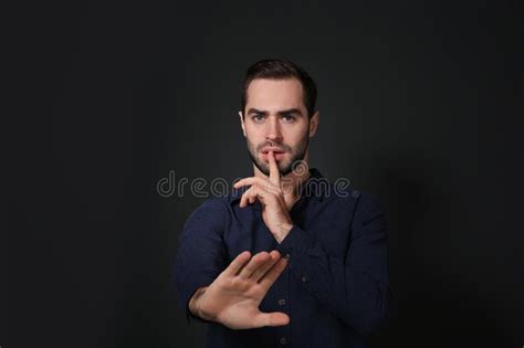 Man Showing Hush Gesture In Sign Language On Black Stock Image Image