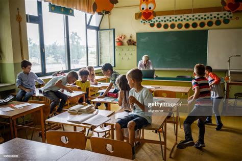 Large Group Of Elementary Students Having Fun On A Class In The