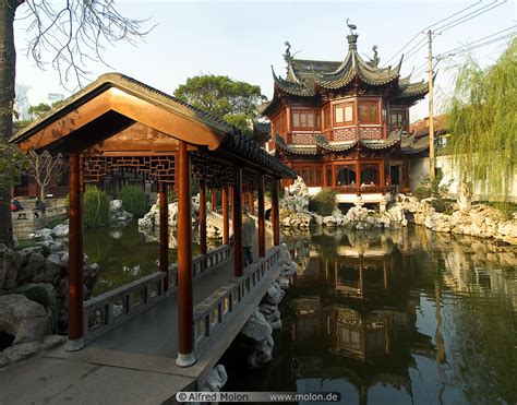 Photo Of Ancient Chinese House On Pond And Bridge Yu Yuan Gardens