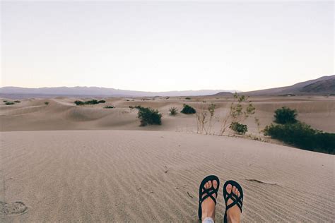 Woman S Feet Relaxing In Desert Sand In Daylight By Stocksy Contributor Holly Clark Stocksy