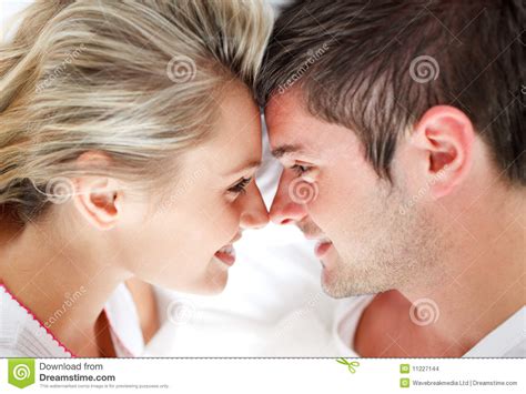 With the help of this platform, learn the appropriate use of the both are close to each other in a sentence. Close-up Of Smiling Couple Looking At Each Other Stock ...