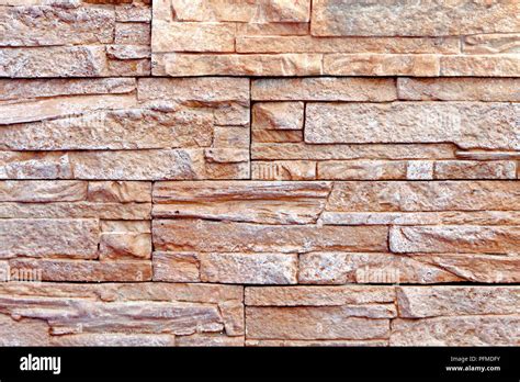 Background Image Of Wall Made Of Natural Stone Tiles Stock Photo Alamy