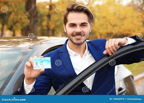 Young Man Holding Driving License Stock Photo Image Of Auto