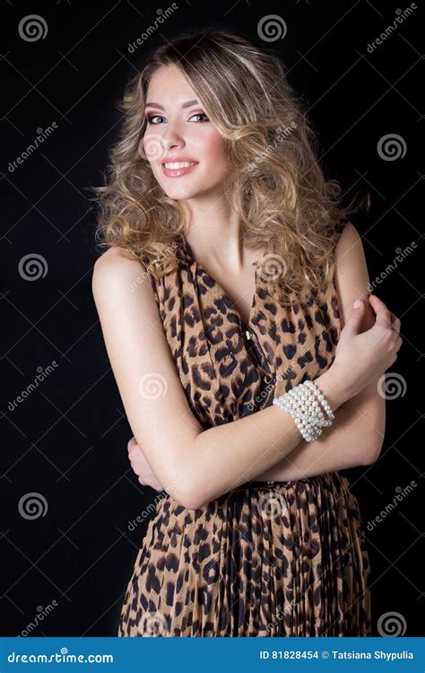 Beautiful Cheerful Woman With Bright Makeup And Evening Festive Hairstyle In Leopard Print