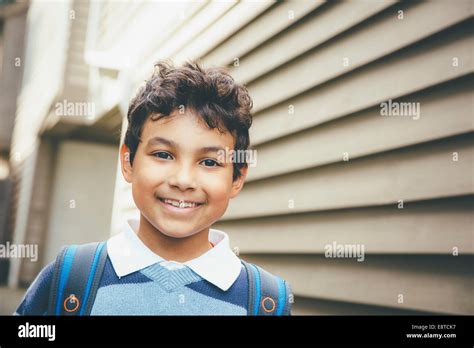 Mixed Race Boy Smiling Near House Stock Photo Alamy