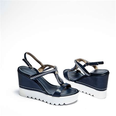 We recommend ordering your usual size. nautical rope wedge sandals in navy and white by ...