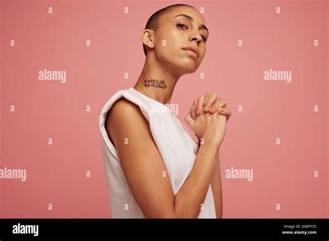 Portrait Of Androgynous Woman Staring At Camera Confident Female With