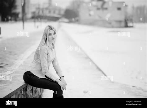Portrait Of Young Cute Blonde Girl On Blouse At Pier Background Foggy