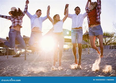 Happy Group Of Young People Having Fun At Beach Stock Photo Image Of