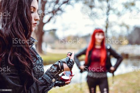Lesbian Gothic Female Thinking About Proposing To Girlfriend Stock