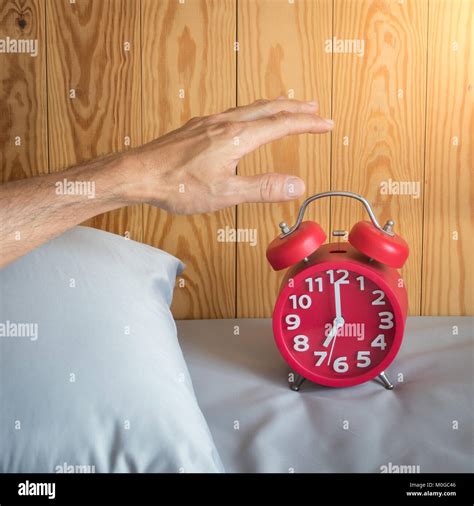 Hand Of A Man Turn Off Alarm Clock At Morning Stock Photo Alamy
