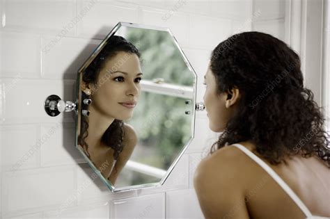 Woman Looking In Mirror Stock Image F Science Photo Library