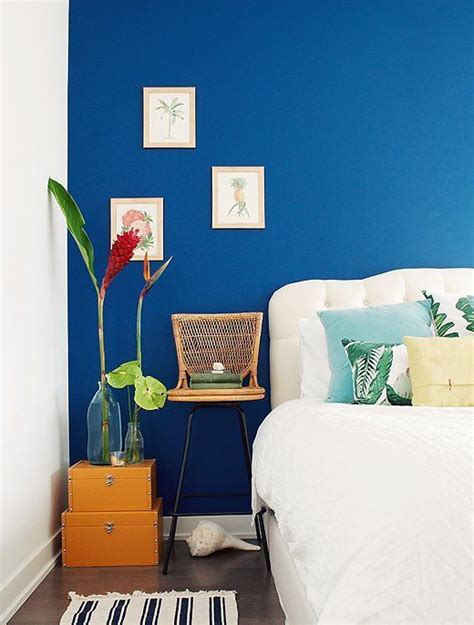 Beautiful Cobalt Blue Accent Wall With Tropical Accessories And Artwork