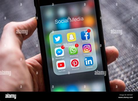 Social Media App Icons Displayed On Apple Iphone Stock Photo Alamy