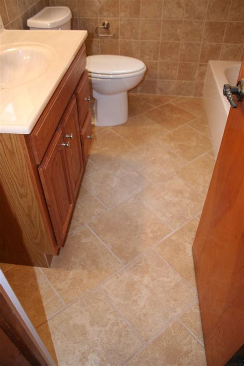 If you decide to replace the bathroom floor tiles, then you should arm yourself with patience and perseverance. Nest Homes Construction - Floor and Wall Tile Designs