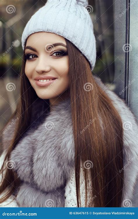 Glamour Girl With Dark Straight Hair Wears Luxurious Fur Coat And