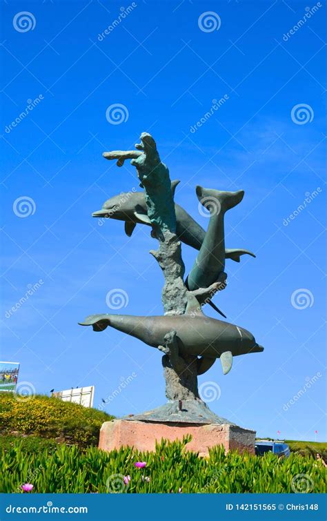 Dolphin Sculpture In The Form Of A Fountain In The Park On The