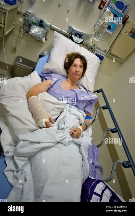 Senior Woman In Hospital Emergency Room Bed After A Night Fall Which Broke Her Are And Wrist On
