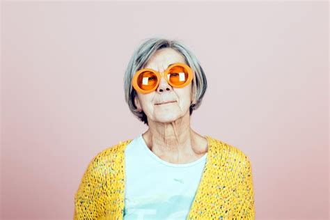 Premium Photo Happy Elderly Grandma Portrait With Orange Sunglasses