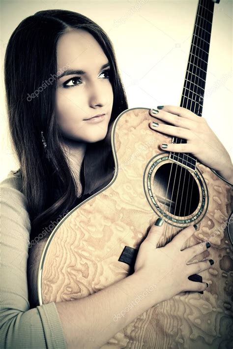 Beautiful Girl Playing Guitar — Stock Photo © Muro 18072571