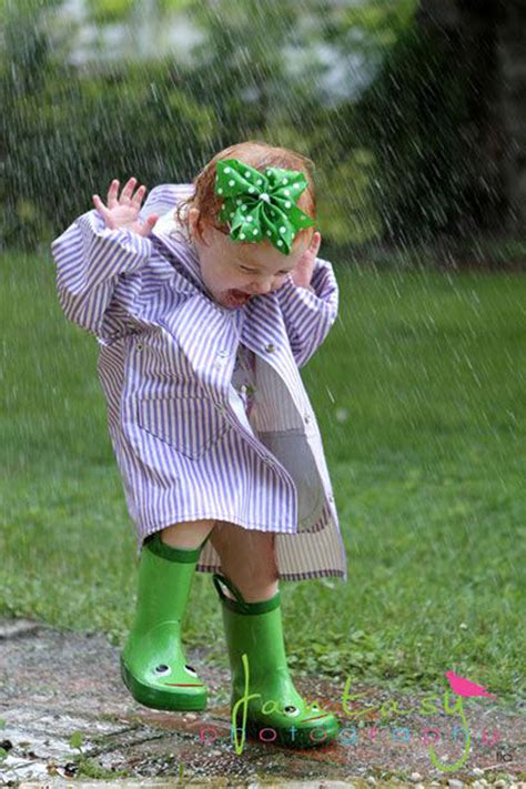 cute baby enjoying rain images