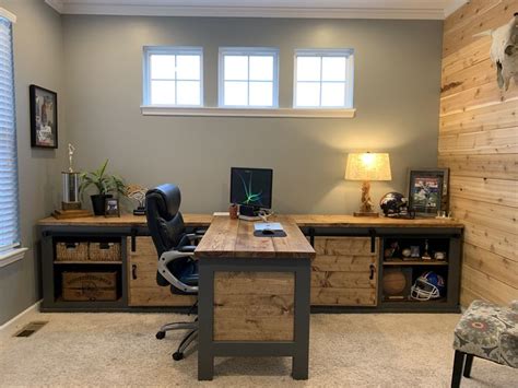 A Home Office With Two Desks And Chairs