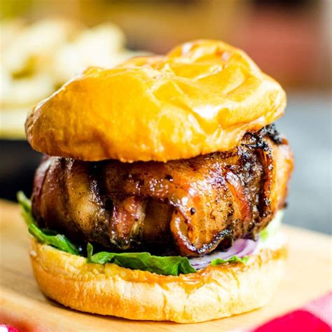 cheese stuffed bacon wrapped burger recipe food above gold