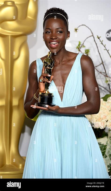 Lupita Nyong O With The Academy Award For Best Supporting Actress For Years A Slave In The