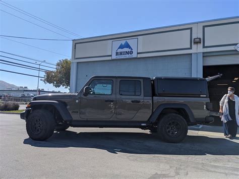 The concept jeep has a rooftop tent that can sleep four and features often found inside a typical camper, such as a refrigerator, stove, and table. California - Gladiator specific camper shell | Jeep ...