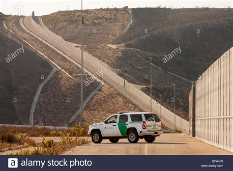 A Border Patrol Suv Polices The Usmexico Border Near