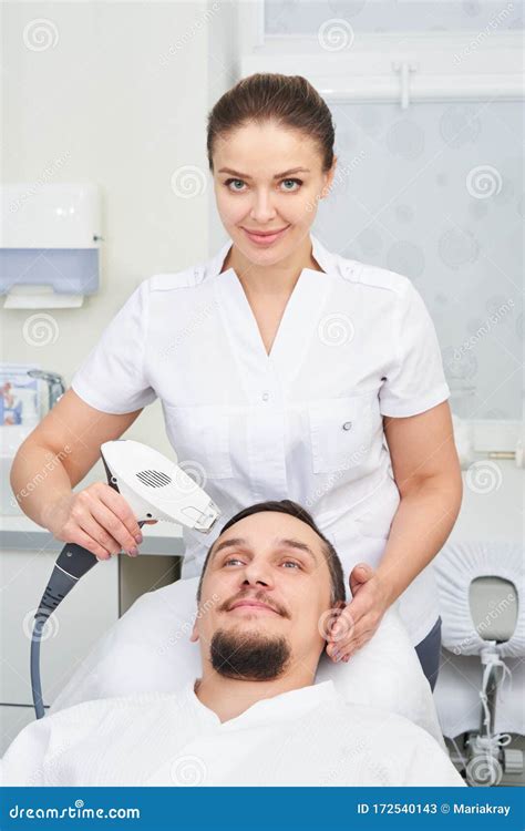 Man Having Laser Treatment At Beauty Clinic Stock Image Image Of