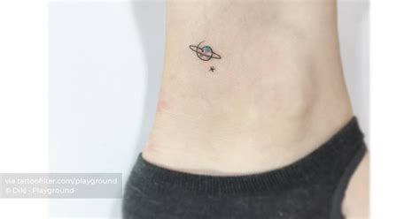 Saturn And Star Tattoo Located On The Ankle