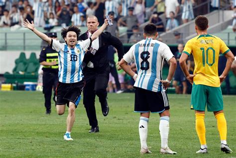 Chinese Fan Runs Onto The Field To Hug Messi During Controversial