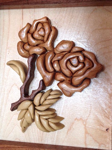 this wooden rose flower intarsia measures 9in wide by 10 in tall and is 1 1 4 in thick it is
