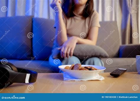 Young Asian Woman Takeaway Eating Junk Food Unhealthy On Couch Watching