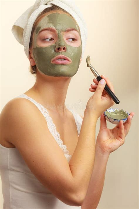 Woman Applying With Brush Clay Mud Mask To Her Face Stock Image Image Of Face Purifying
