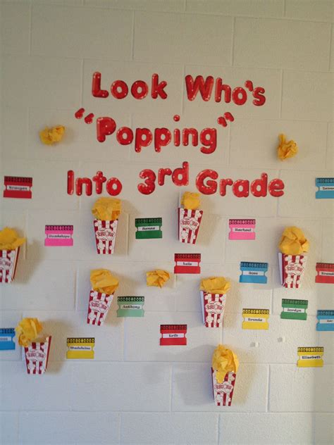 A Bulletin Board With Popcorn On It That Says Look Whos Popping Into