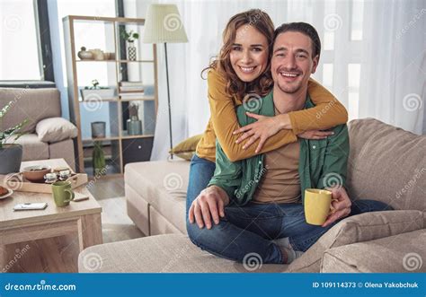 Cheerful Man And Woman Hugging In Living Room Stock Image Image Of
