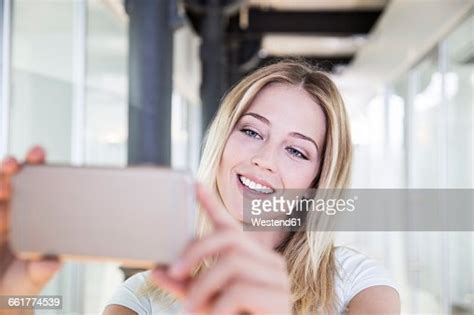 Blond Woman At The Dentists Taking Selfie Of Bleached Teeth Photo