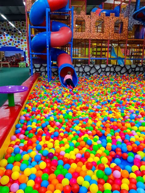 Kids Ball Pool With Slide In Children Playground Indoor Stock Photo