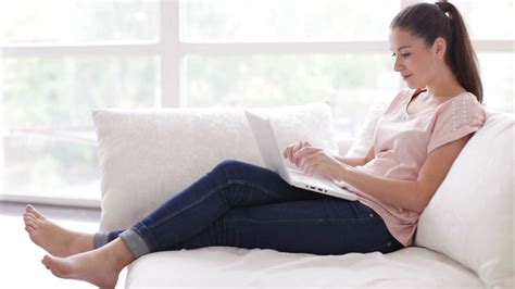 Young Woman Smiling Closing Laptop On Sofa Stock Footage Sbv 303973663 Storyblocks