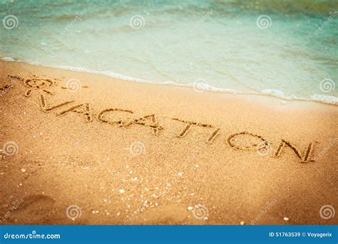The Word Vacation Written In The Sand On A Beach Stock Image Image Of