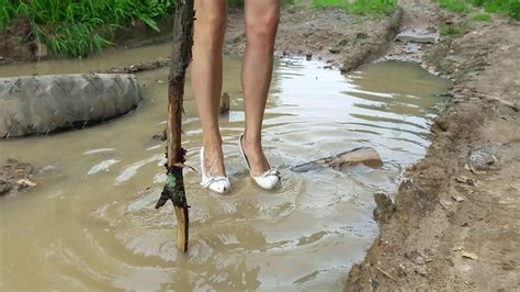 testing how deep the puddles on high heels muddy high heels high heels in mud wet heels