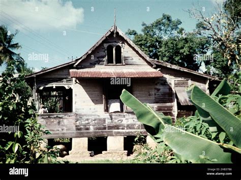 Old wooden house occupied by an Indian family at Arima, Trinidad