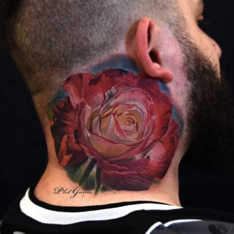 Black rose tattoos done beautifully on her back with thorns and black leaves. Neck Tattoos | Best Tattoo Ideas Gallery