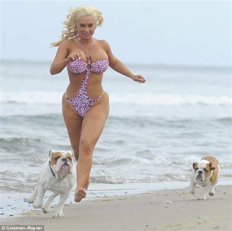 Jiggle It Coco S Dangerous Curves Threaten To Spill Out Of Her Flimsy Swimsuit As She Jogs