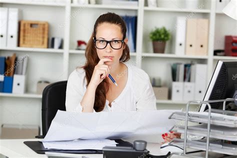 Serious Woman Working At Her Desk ⬇ Stock Photo Image By