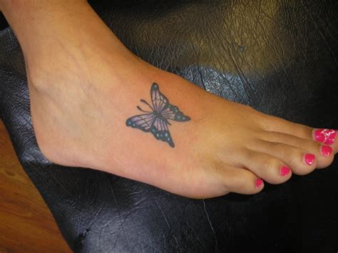 Pretty small butterfly tattoo on foot design - Tattooimages.biz