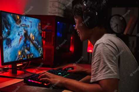 Premium Photo Portrait Of Happy Asian Teenage Gamer Boy Playing Video